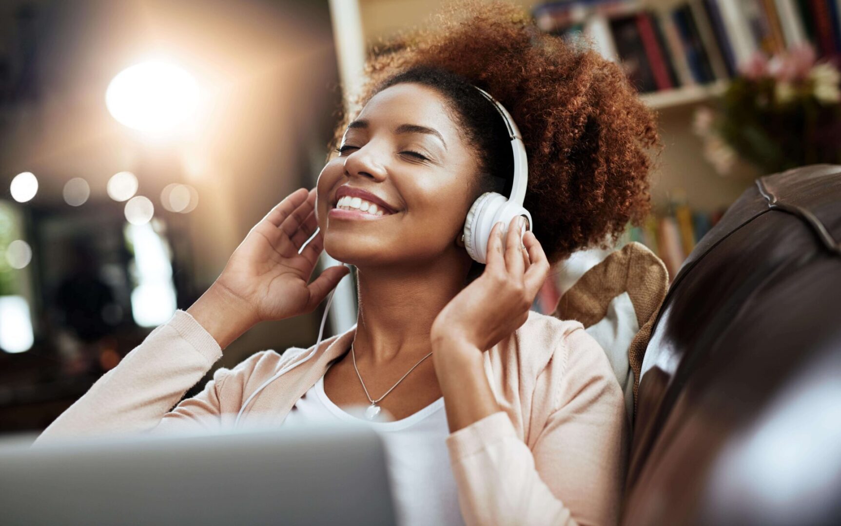 Woman enjoying music with headphones on.